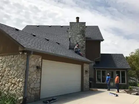 Owens Corning Duration shingles in Fishers, Indiana — roof and chimney view