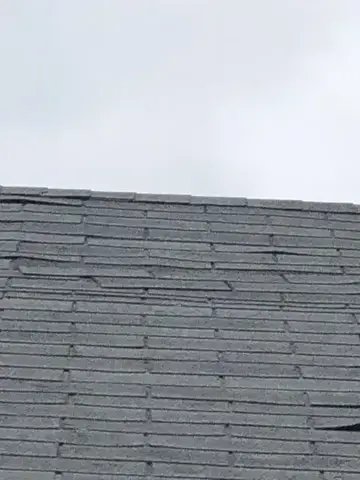 Weathered shingles before roof repair