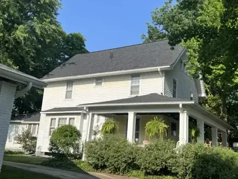 Completed shingle roof on a two-story home