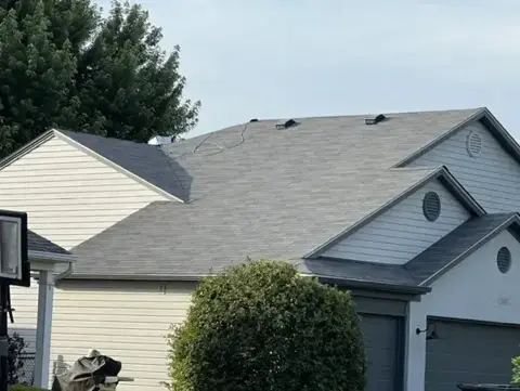 Completed shingle roof above a front gable