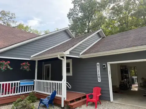 James Hardie Night Gray fiber cement lap siding project in Nineveh, Indiana — front and garage view